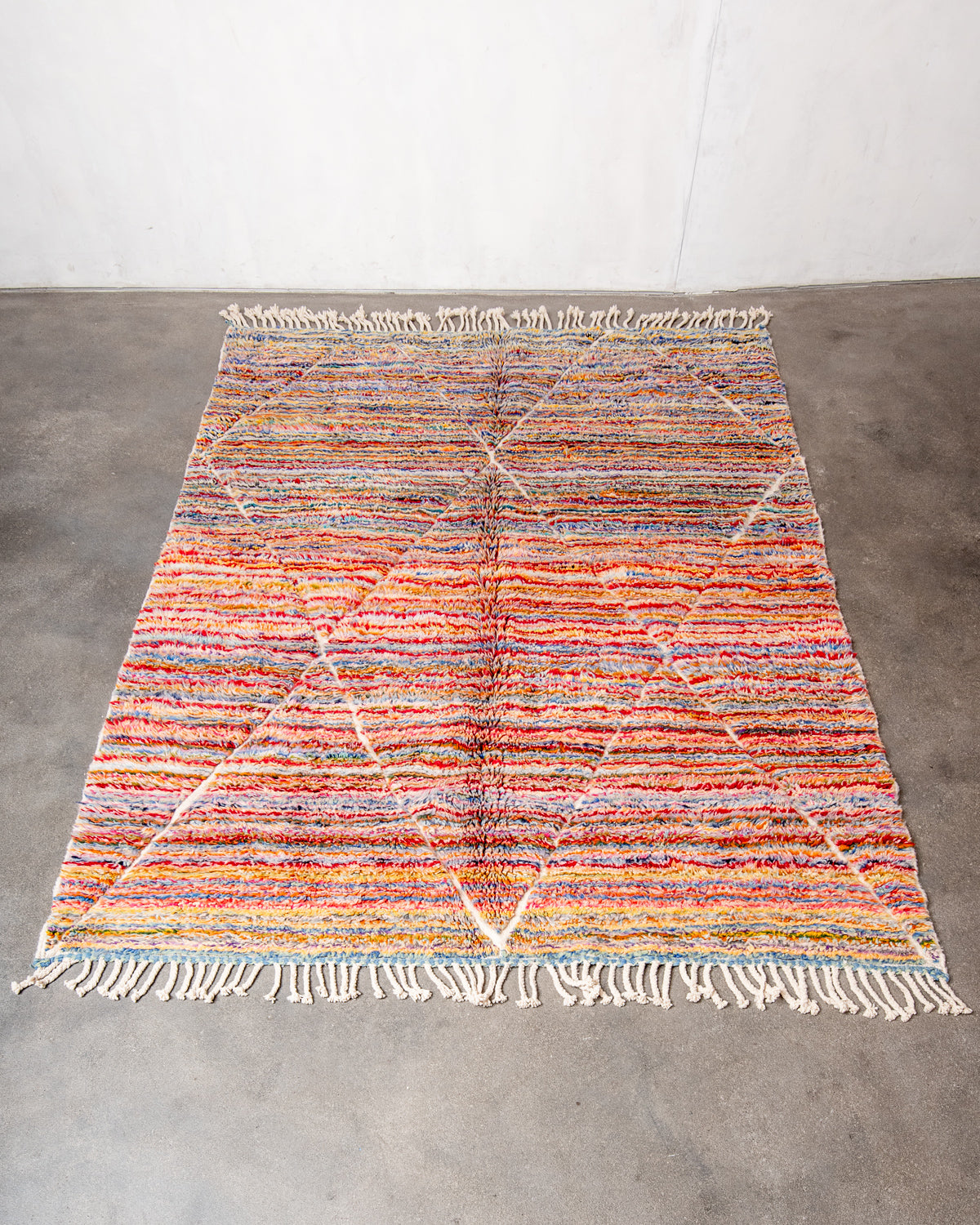 Modern, designer, handcrafted Berber rug from Morocco. Beniourain carpet with beautiful colours and patterns and fluffy wool texture.